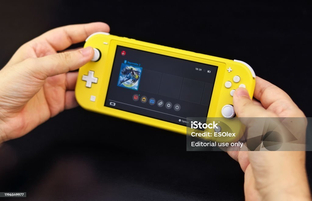 Nintendo Switch Lite Is Nintendos Latest Entry Into Handheld Gaming Priced  At 19999 The Switch Lite Is Available In Yellow Color Stock Photo -  Download Image Now - iStock