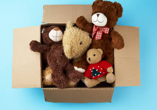 istock brown cardboard box with various teddy bears 1196559745