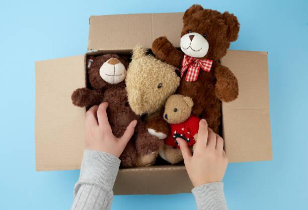 istock brown cardboard box with various teddy bears 1196560539