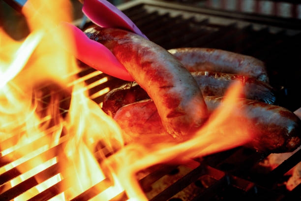 istock Fresh-Made Bratwurst on a grill with flames 1196563972
