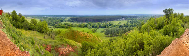 Spring landscape - view of the river valley which meanders between hills and forests
