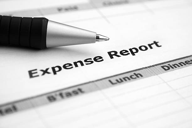 Close-up of an expense report and ballpoint pen stock photo