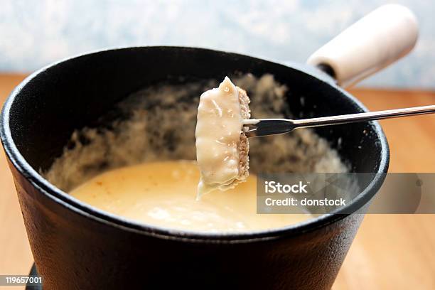 Fork Pulling Out Of Cheese Fondue Pot Stock Photo - Download Image Now - Cheese Fondue, Bread, Cast Iron