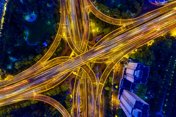 istock Urban highway traffic shanghai at night 1196570372