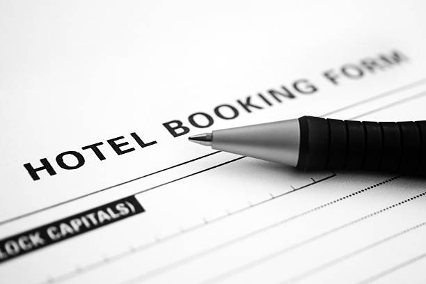 modulo di prenotazione - hotel reception paper hotel tourism foto e immagini stock