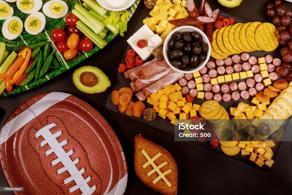 Delicious charcuterie board and veggie with dipping for championship game game. Delicious charcuterie board and veggie with dipping for championship game football game. American Football - Sport Stock Photo