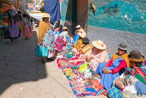 Copacabana Bolivia, August 16 portrait of a women in traditional clothes selling food in on one of the street of Copocabana. Shoot on August 16, 2019