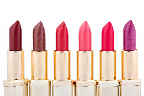 istock Multicolored color lipsticks arranged in line isolated on white 119657158