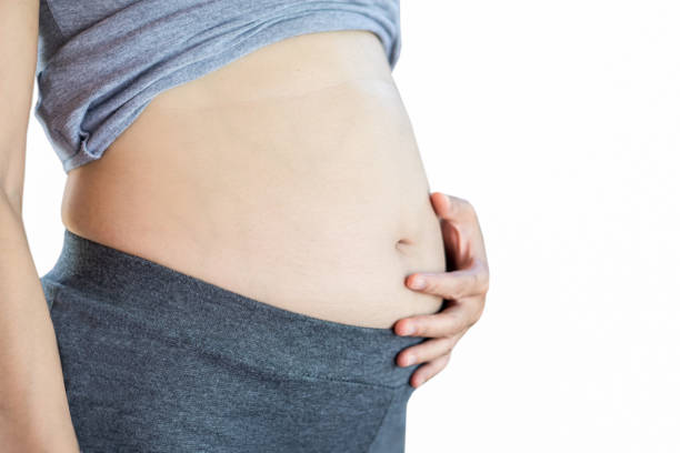 istock Pregnancy or overweight belly 1196574492