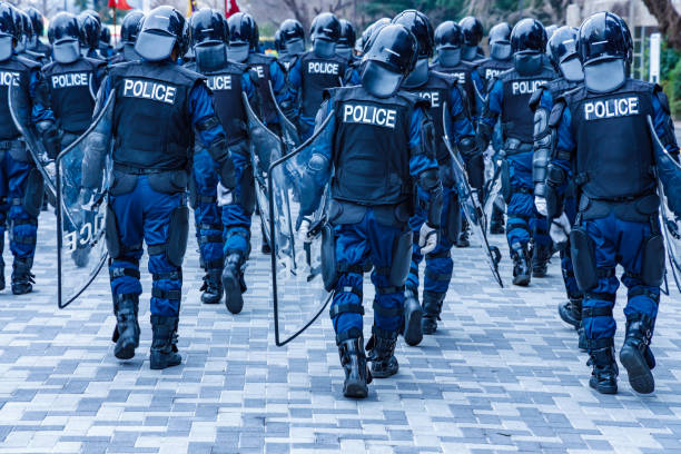 Police riot police protecting the peace of the city Police riot police protecting the peace of the city riot photos stock pictures, royalty-free photos & images