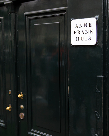 Amsterdam, Netherlands - December 20th 2019: The sign on the exterior of Anne Frank House in Amsterdam, Netherlands. The house is where Anne Frank hid from Nazi persecution and is now a museum.