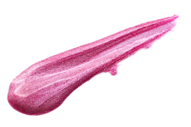 istock Lip gloss isolated on white. Smudged pink makeup product sample. 1196580926