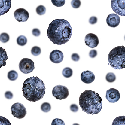 Seamless pattern with falling fresh blueberries isolated on white background. Flying berry