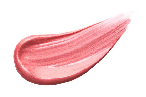 Lip gloss isolated on white. Smudged pink makeup product sample.
