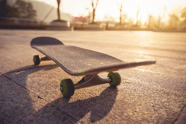 istock Skateboard ready for riding at sunrise city 1196590375