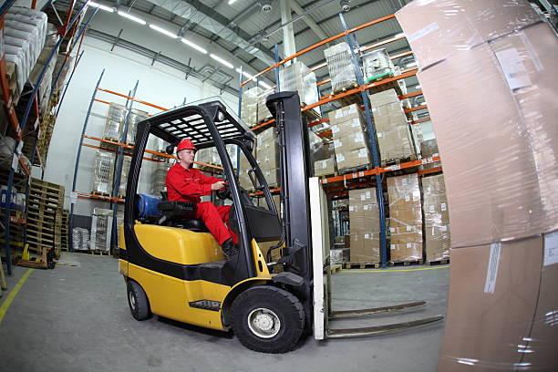 istock forklift truck reloading pallets in storehouse 119659496