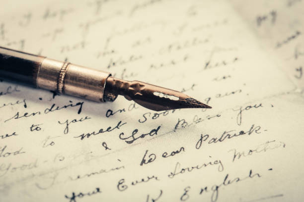 istock fountain pen on paper with ink text closeup 1196596891