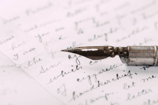 istock fountain pen on paper with ink text closeup 1196596908