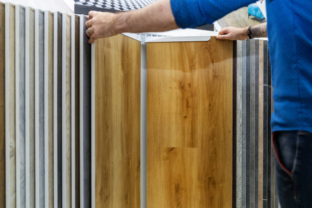 istock man choosing floor laminate for his home in flooring store 1196605717