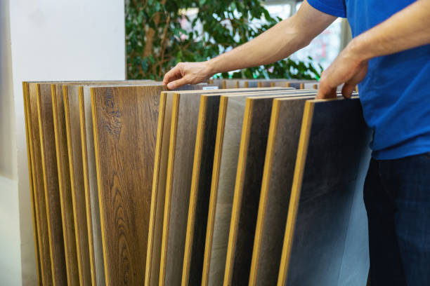 istock man choosing floor laminate for his home in flooring store 1196605732