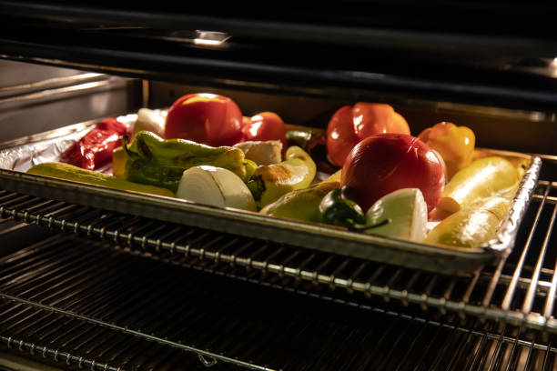 istock Vegetables Roasting in Oven - Well Lit 1196606710