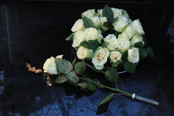 istock Funeral flowers on a tomb 1196606862