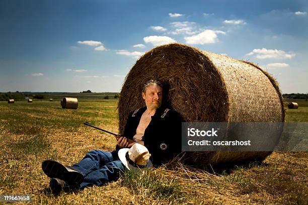 Resting Farmer In Field Stock Photo - Download Image Now - Farmer, Gun, Agricultural Field