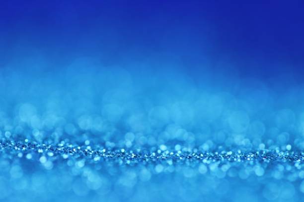 istock blue glitter shiny background.panton 2020 classic blue.glitter blue gradient texture with bokeh. New year phone wallpapers 1196619634