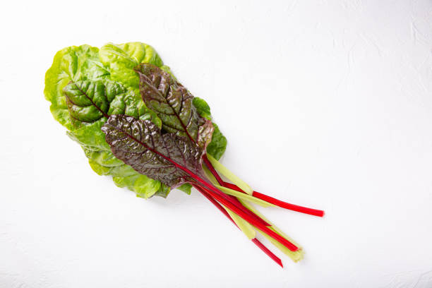 istock Bunch of fresh chard leaves on white background. Top view. 1196619652