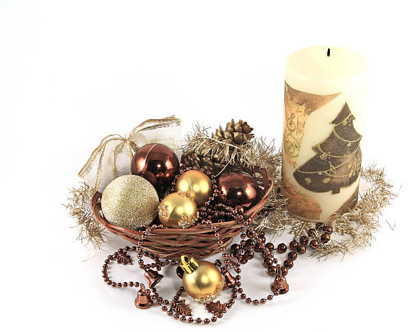 Basket with christmas balls and the candle stock photo