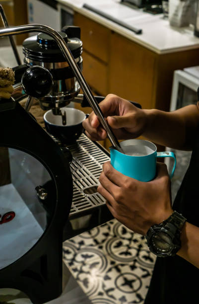 istock Close Up of Barista Hand Making a Coffee 1196624671