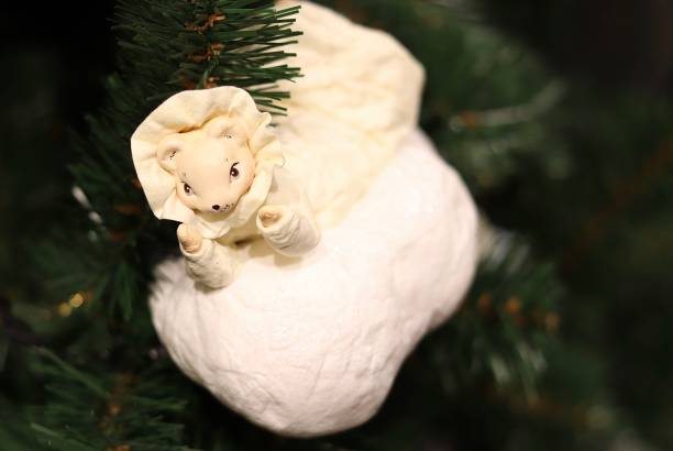 istock The christmas mouse toy on the green tree 1196625685