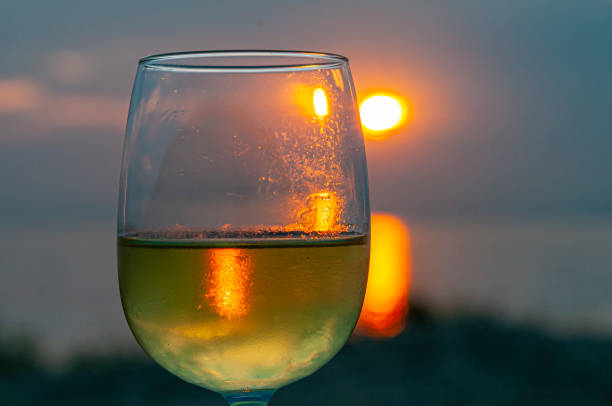 istock Wine by the sea at sunset 1196625821