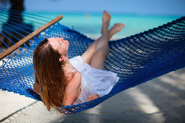 istock Woman relaxing in hammock 119662654