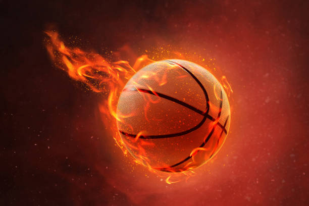 istock Burning basketball on fire background 1196628642