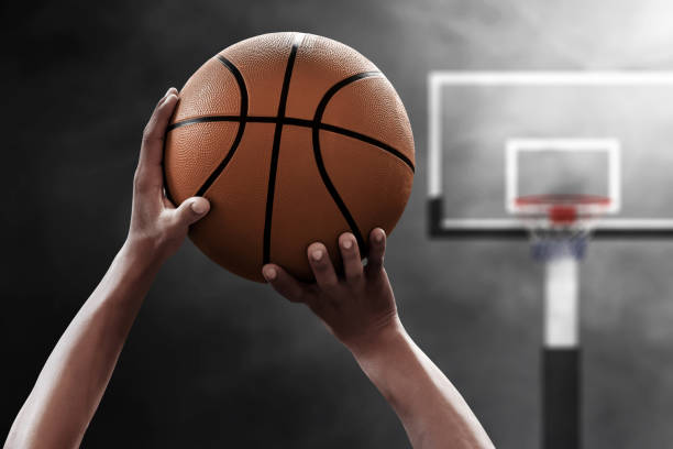 istock Basketball player throwing a ball 1196628672