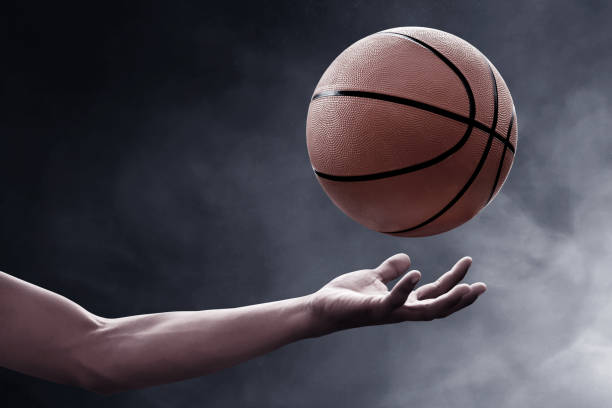 istock Basketball player throwing a ball 1196628713