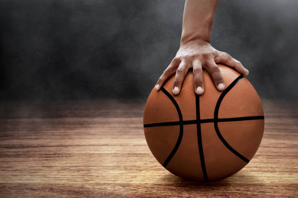 istock Basketball player holding a ball 1196628852