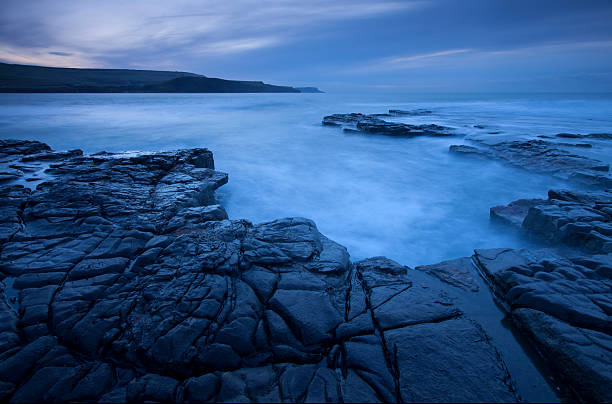 Sunrise over Kimmeridge Bay, Dorset, UK stock photo