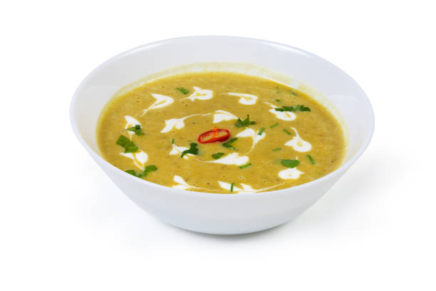 istock Lentil pumpkin soup puree in white bowl on white background 1196631126