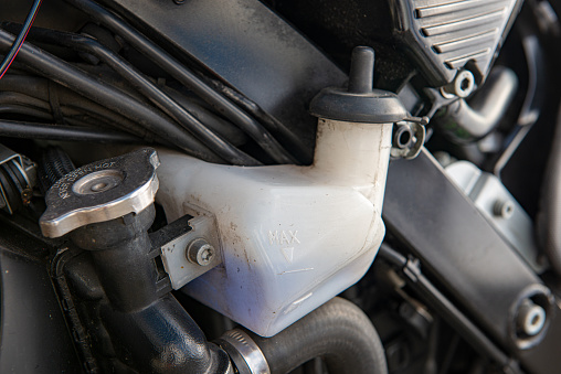 a close up of coolant tank  of motorbike