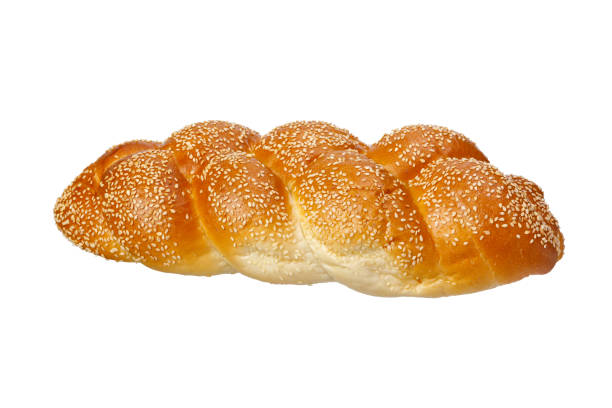 One baked braided challah with seeds One baked braided challah with seeds isolated on white background judiaca stock pictures, royalty-free photos & images
