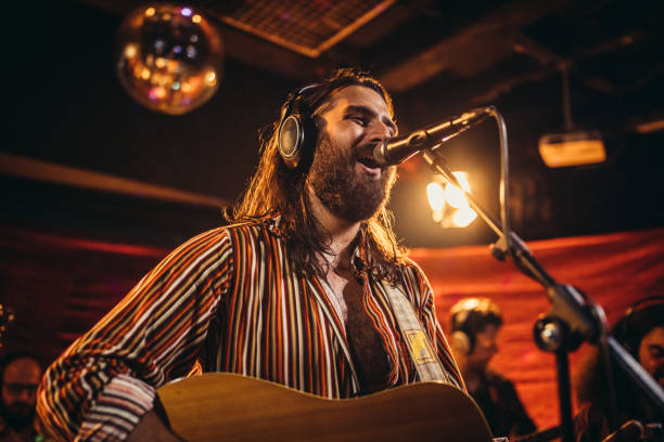 istock Man musician performing on stage 1196634003