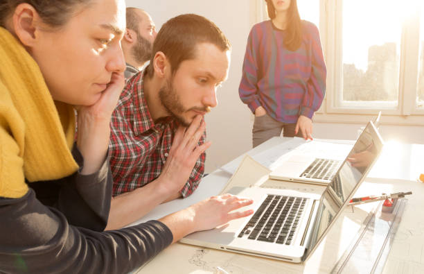 istock Team made of young architects in the sunny office. 1196635336