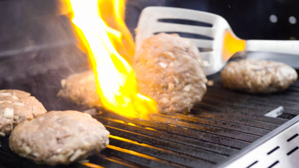 istock Cooking hamburger beef patties on a gas grill. 1196640842