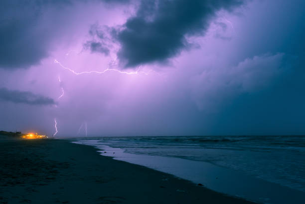 istock Powerful display of lightning over sea 1196640881