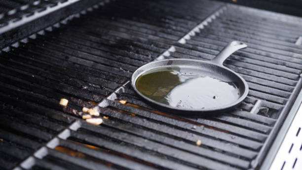 istock Cooking eggs in cast iron skillet on a gas grill. 1196640988