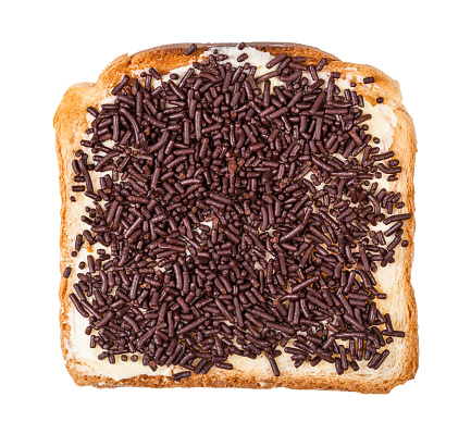 top view of dutch sweet toast with butter and hagelslag (topping from chocolate sprinkles) isolated on white background