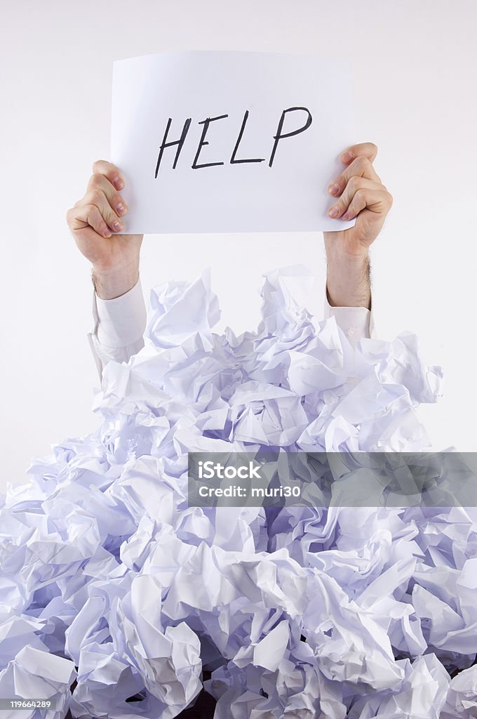 Empresario abrumado por papel - Foto de stock de Acorralado libre de derechos