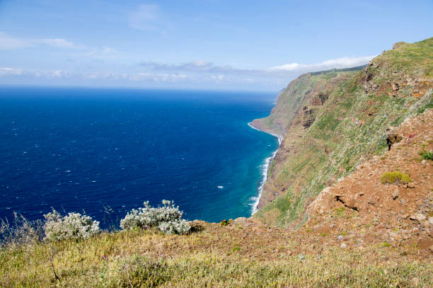 istock View from Ponta do Pargo view point, view over the cliff, amazing wild nature greenery, blue deep Atlantic ocean, Madeira island 1196643898